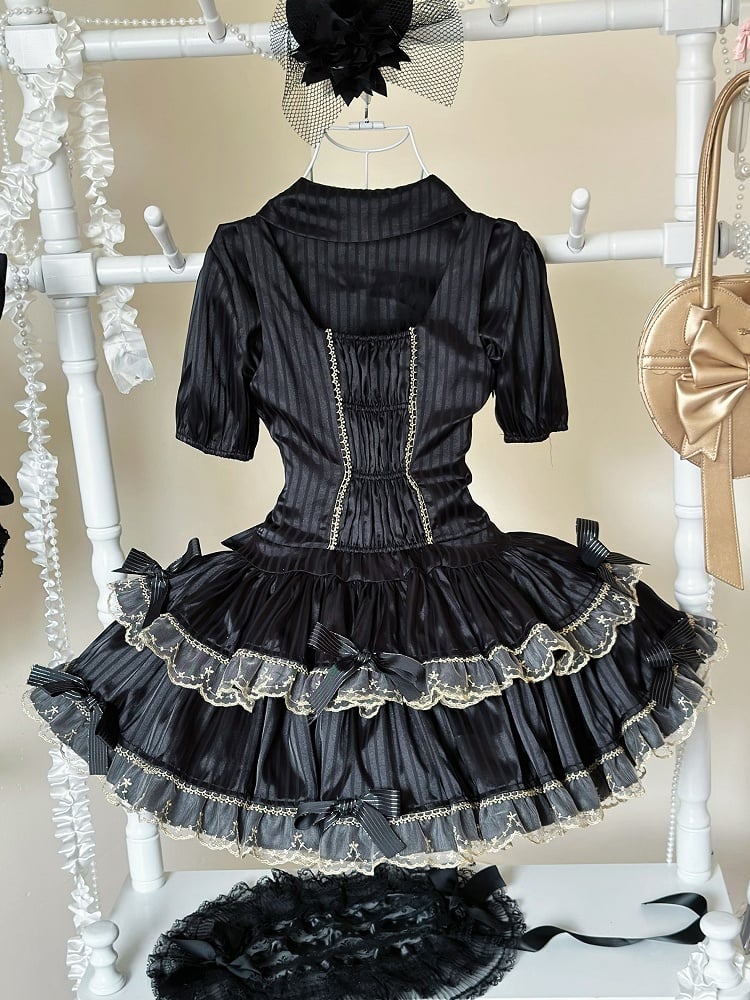 Bluse schwarz elastisch gestreift und kurze goldene Manschetten Stoffärmel