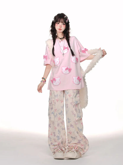 白/ピンクの蝶結びTシャツ柄 かわいい子猫