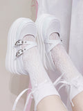 Plateauschuhe mit Schnallen und Flügel-Design in Weiß
