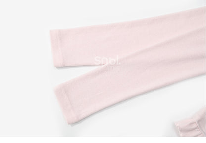 Rosafarbenes, langärmliges Oberteil mit Rüschenbesatz und Schleifendetails