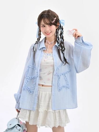 セミシースルーのフリル付き蝶結びアップリケ付きブルーサンプロテクションシャツ