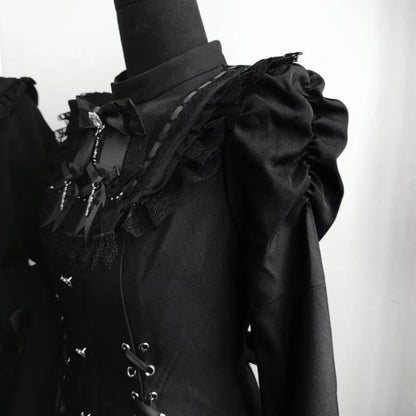 Close-up of black lace neckline and shoulder ruffles on gothic Lolita dress