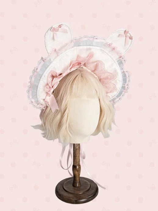 ピンクと白/黒のボンネット耳のウサギ