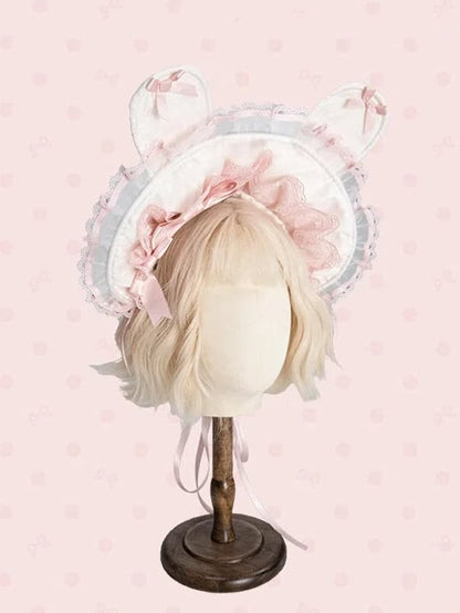 ピンクと白/黒のボンネット耳のウサギ