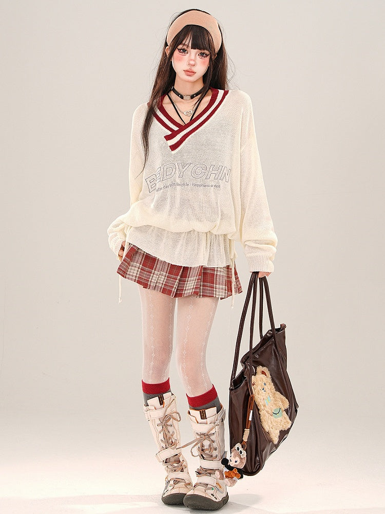 Aprikosenfarbenes, halbtransparentes, lockeres Strickoberteil mit V-Ausschnitt und gerüschter Taille