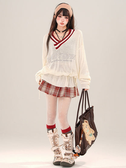 Aprikosenfarbenes, halbtransparentes, lockeres Strickoberteil mit V-Ausschnitt und gerüschter Taille