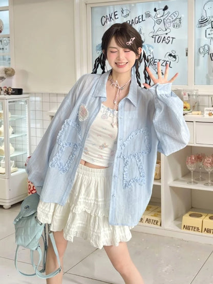 セミシースルーのフリル付き蝶結びアップリケ付きブルーサンプロテクションシャツ