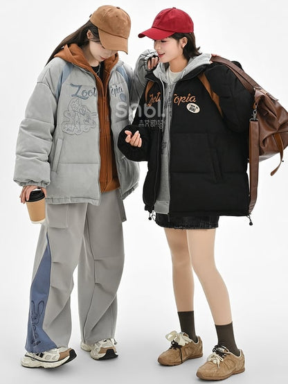 Schwarze Pufferjacke mit „Zootopia Judy and Nick“-Applikation