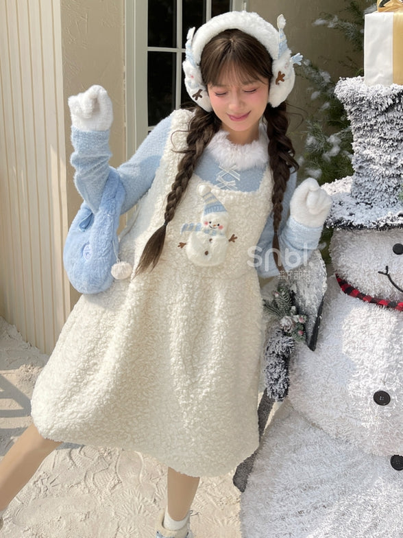 Blaues, langärmliges Oberteil mit Plüschbesatz am Ausschnitt und Schleifendetails