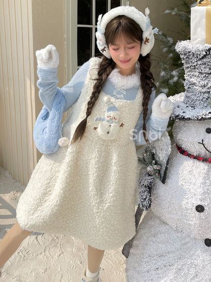 Blaues, langärmliges Oberteil mit Plüschbesatz am Ausschnitt und Schleifendetails