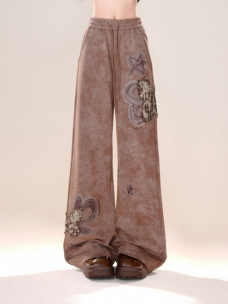 Braune Schmetterlingshose mit weitem Bein und Applikation im Karomuster