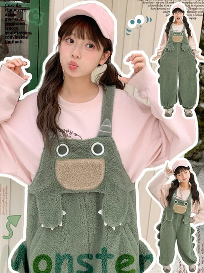 かわいい恐竜の緑のぬいぐるみオーバーオール