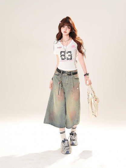 ブルーのローライズ ダメージ加工 スパンコールディテール ストレートレッグジーンズ