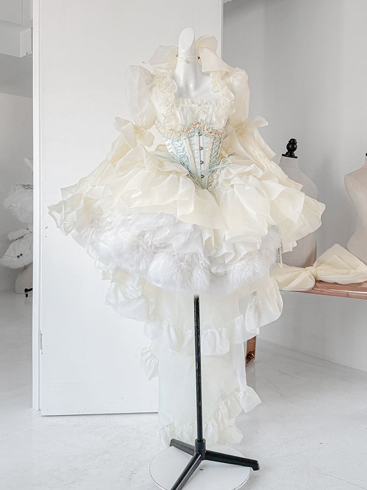 Hellgelbes, transparentes Oberteil mit langen Ärmeln und kaskadierendem Rüschensaum