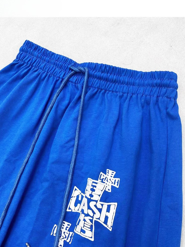 文字の帆船と十字架のプリントが施されたブルーのY2K Aラインスカート