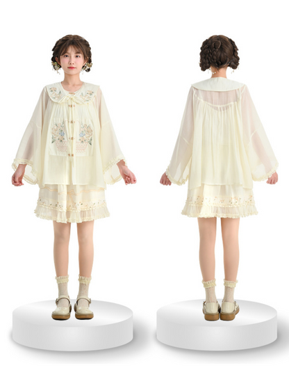 Rüschenhemd, angesetzter Rock mit chinesischem Kragen + transparenter Waldstoff