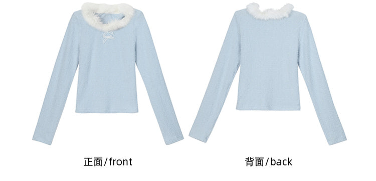Blaues, langärmliges Oberteil mit Plüschbesatz am Ausschnitt und Schleifendetails