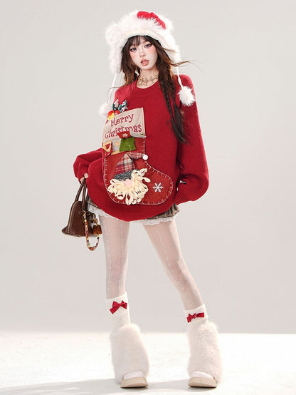 赤いクリスマスストッキングのラウンドネックルーズセーター