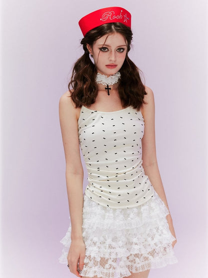 ベージュ オールオーバーデザイン バックキャミトップ 蝶結びプリント ウィング