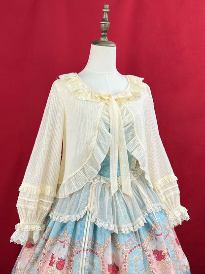 Aprikosenfarbenes Oberteil mit Volantbesatz, Knopfleiste und selbstbindendem Ausschnitt und langen Ärmeln