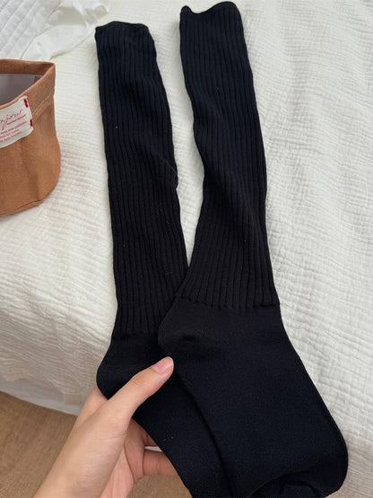 Gestrickte Beinwärmer in Weiß/Aprikose