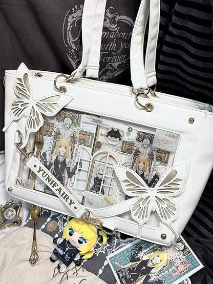 Abnehmbare Ita-Umhängetasche in Gold mit Schmetterlings- und Spinnennetz-Detail in Weiß