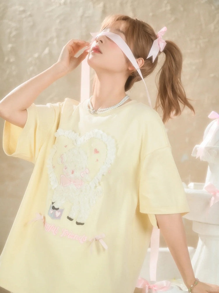 イエローのプラッシュラムアップリケフリルハートルーズTシャツクリーミー