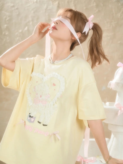 イエローのプラッシュラムアップリケフリルハートルーズTシャツクリーミー