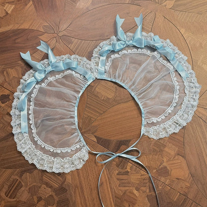 Verzierte blaue Auflage / Schleifenband rosa