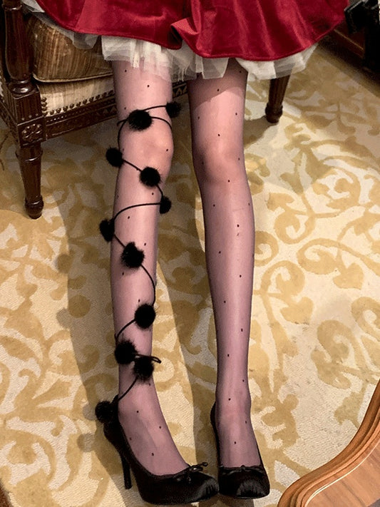 黒/白の水玉模様のポンポン付きタイツ