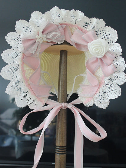 ピンク/ブルーの花柄リボンディテール、レーストリムのボンネット