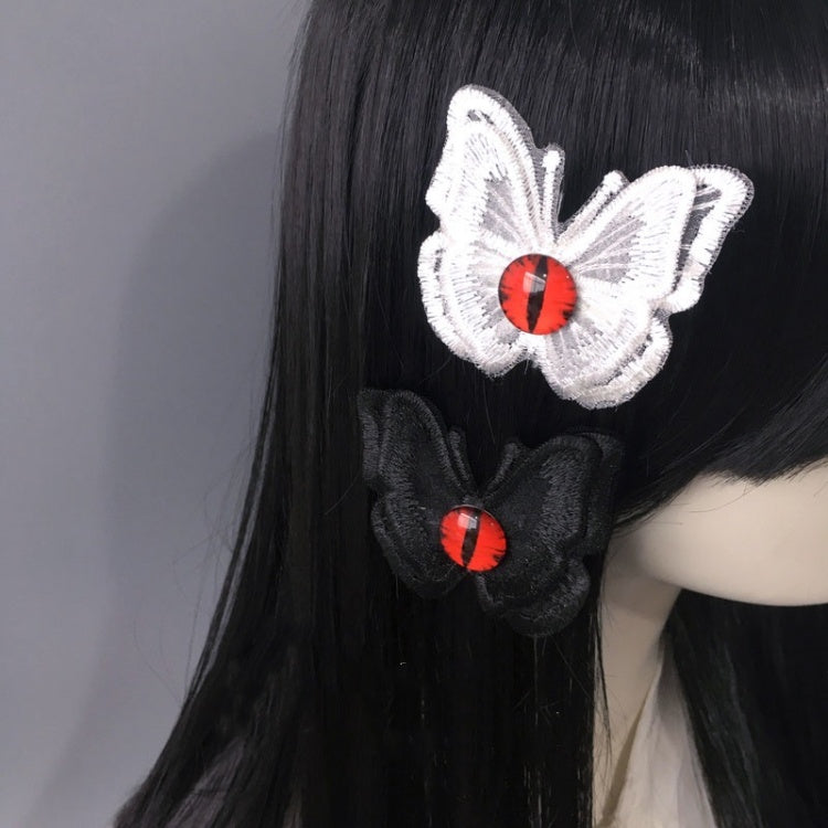 Gothic Haarspange mit rotem Auge und Schmetterling