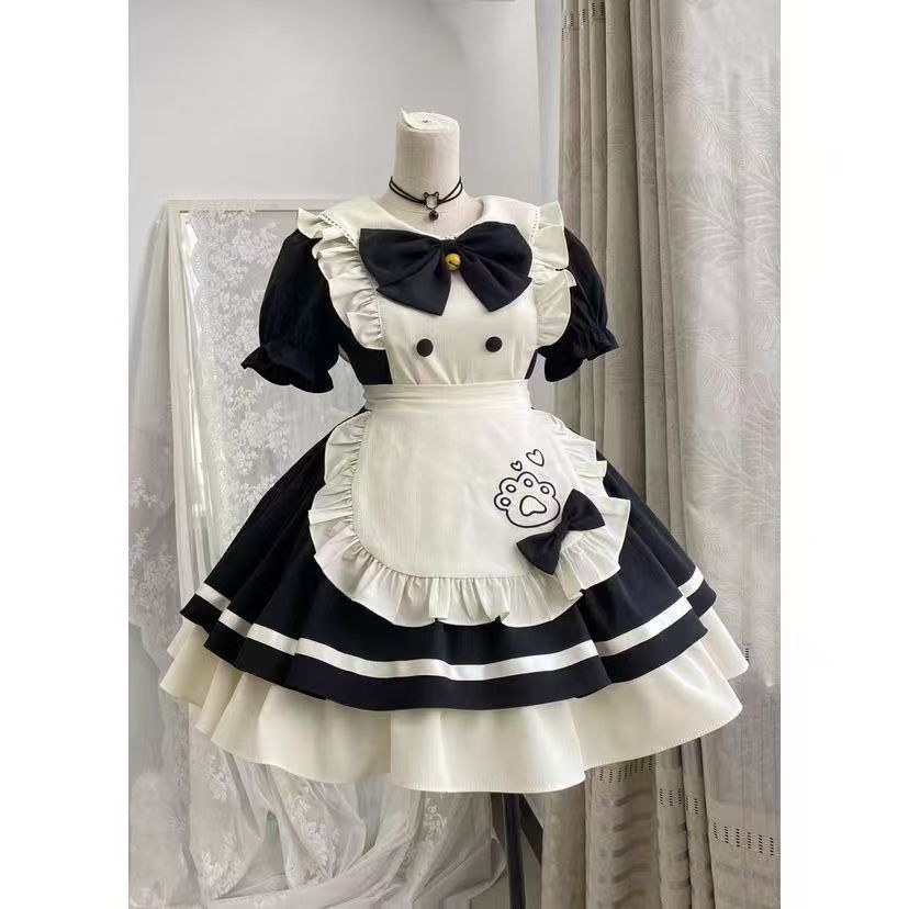 White and black maid outfit with apron on a mannequin against a neutral background