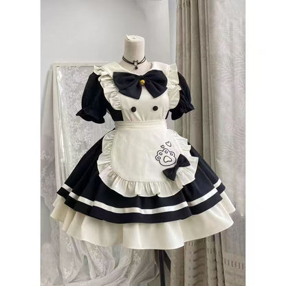 White and black maid outfit with apron on a mannequin against a neutral background