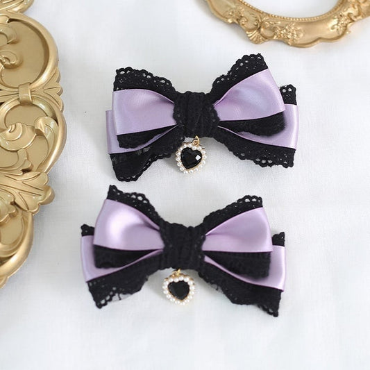 A Pair of Black & Purple Bowknot Lace Hairclips With Heart Charms