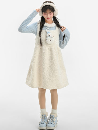 Blaues, langärmliges Oberteil mit Plüschbesatz am Ausschnitt und Schleifendetails