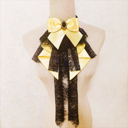 Yellow bow neck accessory with dark lace layers