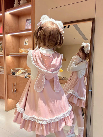 水玉模様の蝶結びロリータジャンパースカートのディテール、ウサギの耳のデザイン、甘いウエストフード、ピンク