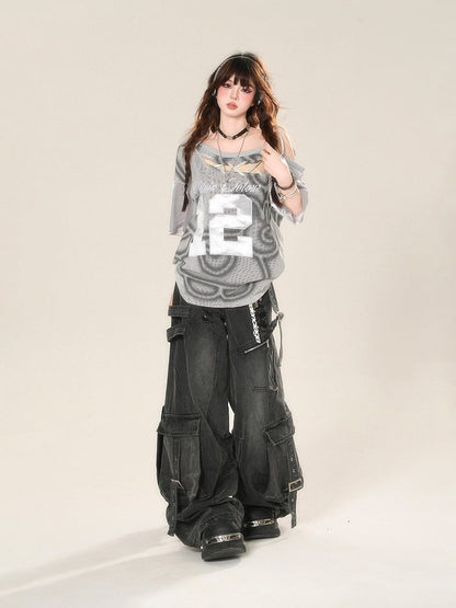 Schwarze Distressed-Jeans mit weitem Bein und Löchern, Schnalle, Cargotaschen und Riemen