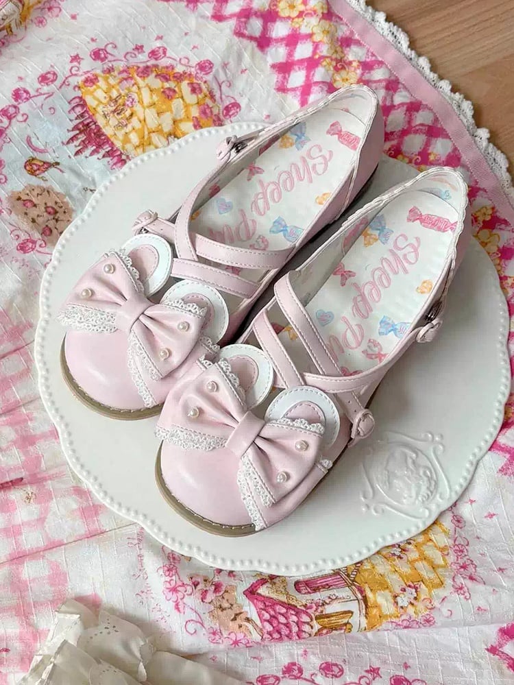 Rosa Ohrstecker mit Hasenschleife, kreuz und quer mit Perlen verziert