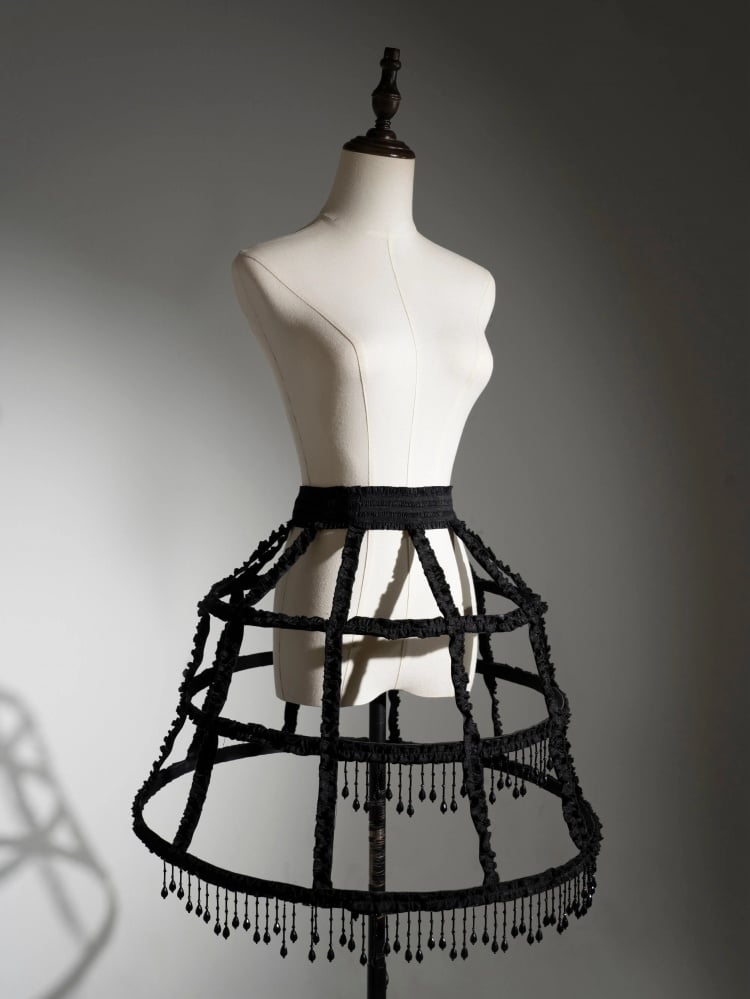 Schwarzer Unterrock mit Perlenquasten und Vogelkäfig-Design
