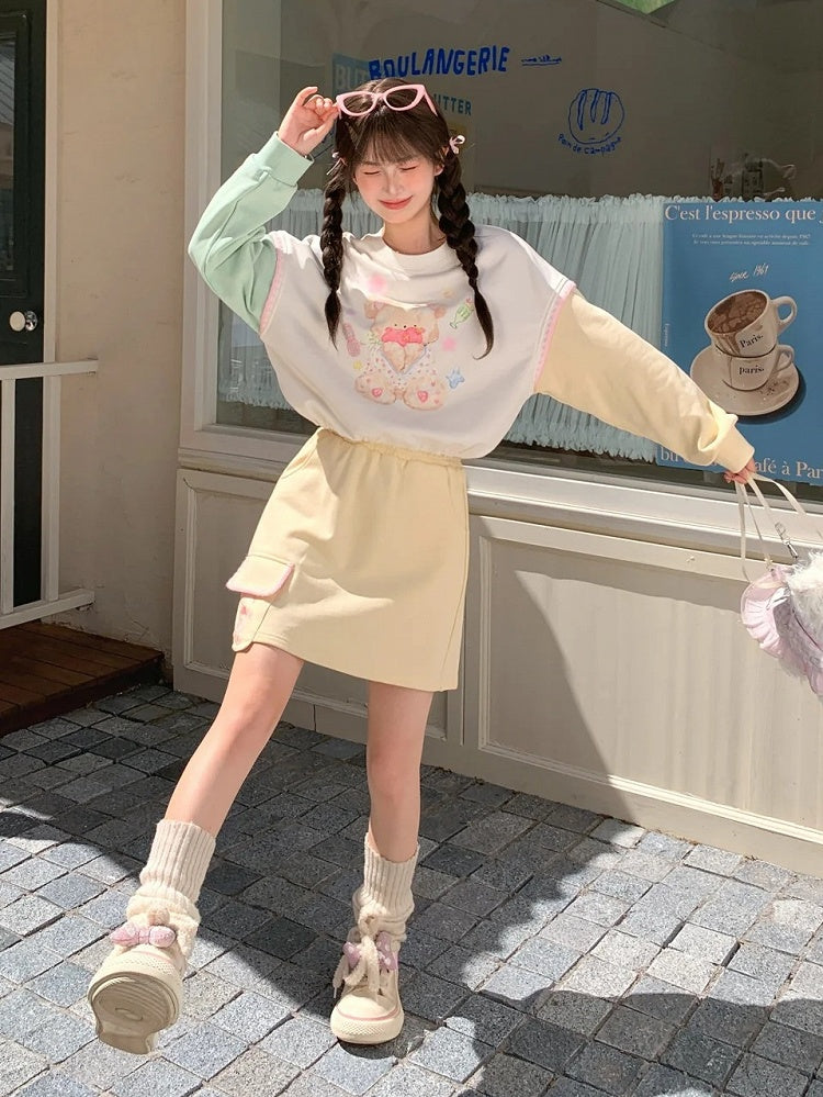 Grüner Teddybär-Druck Kordelzug Sweatshirt Saum Gelbes Design Colorblock Herbst und