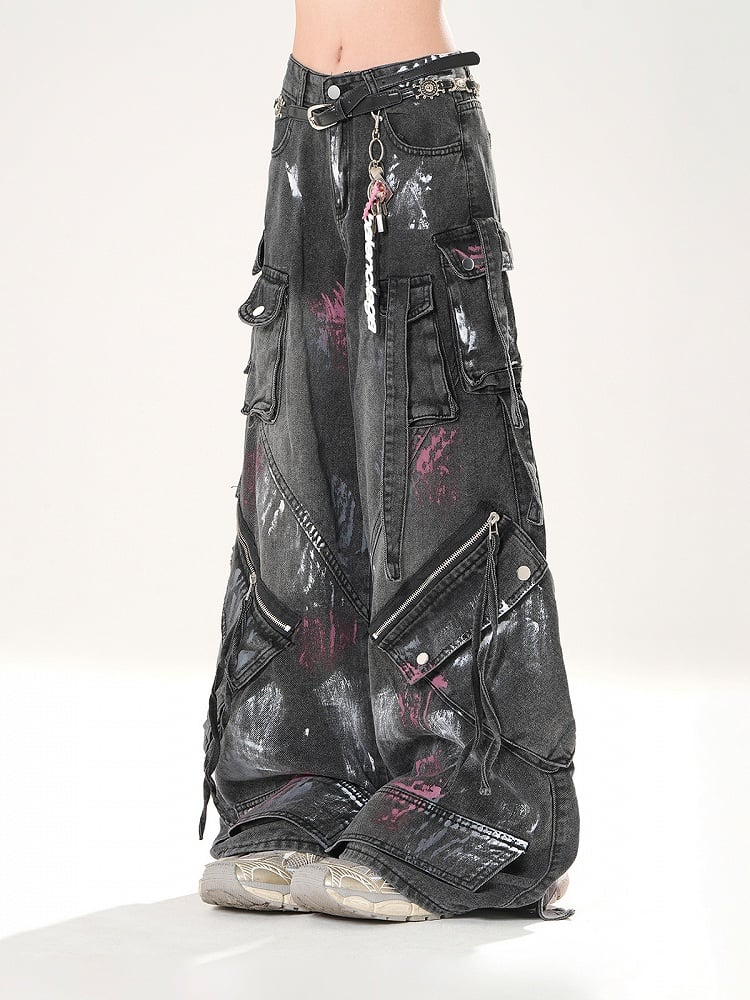 Schwarze Jeans mit weitem Bein und Used-Look, Reißverschlussdetails, niedriger Sprühfarbendruck