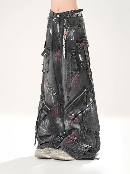 Schwarze Jeans mit weitem Bein und Used-Look, Reißverschlussdetails, niedriger Sprühfarbendruck