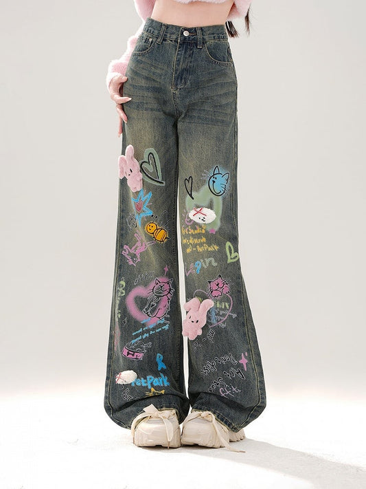 Wide-Leg Jeans with Colorful Graffiti and Detachable Pink Bunny Plushie Blue