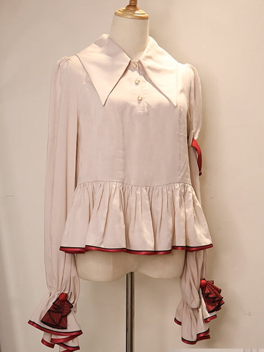 コントラストレッドトリムのフラウンスヘムベージュシャツ