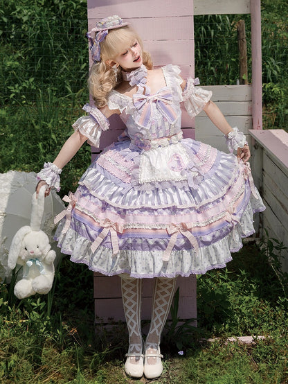 Gestuftes Lolita-Rock mit lila Akzenten, Kuchen-Taro-Paste, süßes Schleifenkleid
