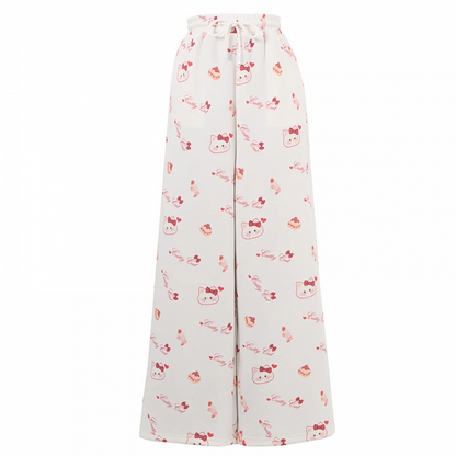 ホワイトのドローストリングウエスト、全体にキティプリントのワイドレッグカジュアルパンツ