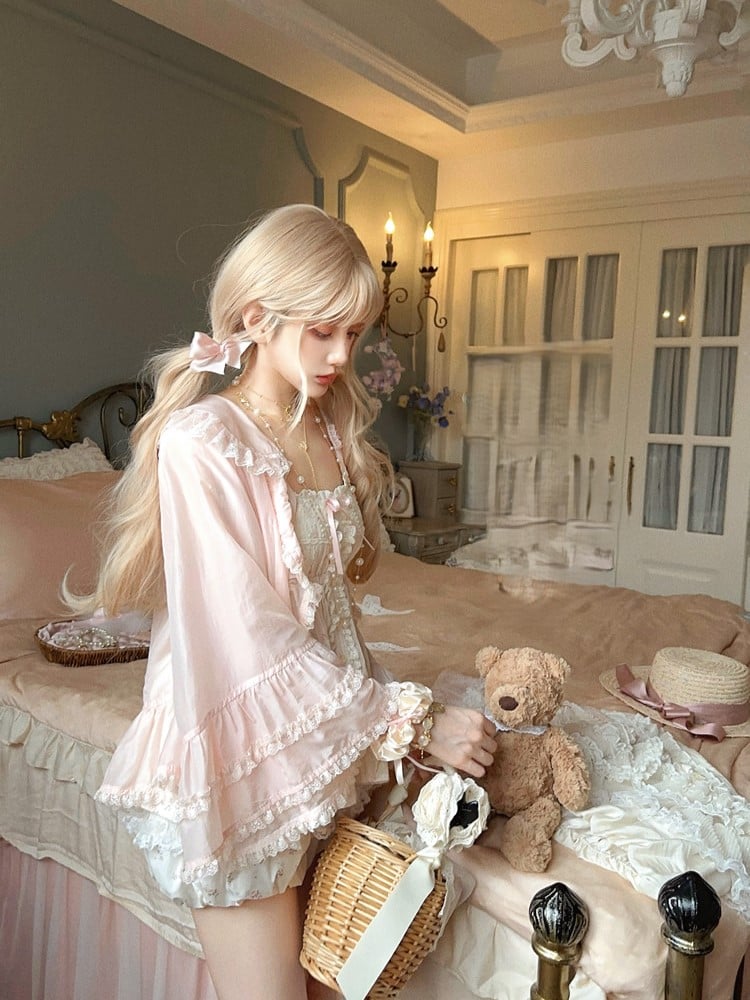 Gerüschte, sonnenschützende rosa Ärmel mit Cardigan-Glocke