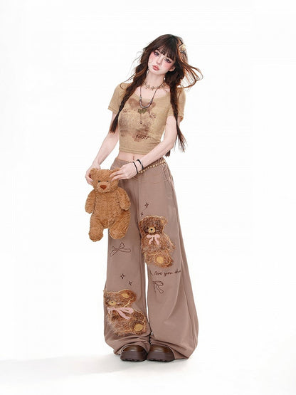 Braune, lockere Hose mit weitem Bein und Teddybär-Schleifendetail aus Plüsch